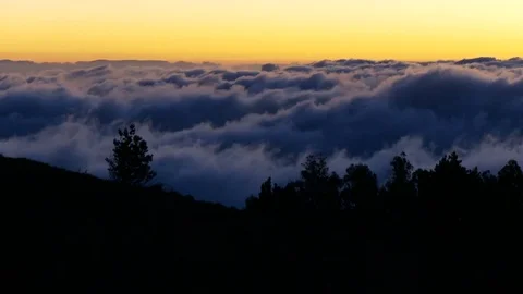 Yellow sky over rolling clouds timelapse Stock Footage 74097584