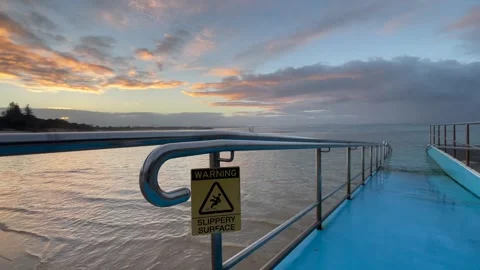 Yellow Slippery Surface Warning Sign at Forster Ocean Baths 스톡 동영상 338382872