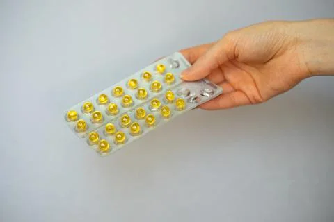 Yellow small round complex of vitamins and minerals Stock Photos