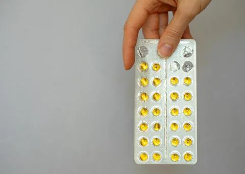 Yellow small round complex of vitamins and minerals Stock Photos