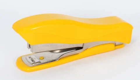 Yellow small stapler Stock Photos