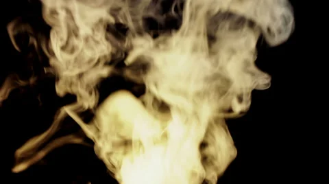Yellow smoke on black background Stock Footage 33863258