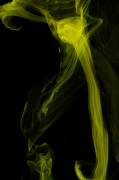 Yellow smoke on black background Foto stock