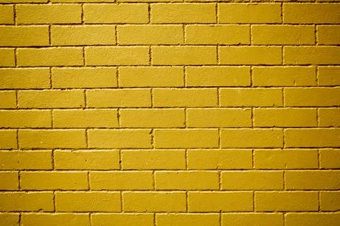 Yellow smooth brick wall. rough surface. concrete texture Foto stock