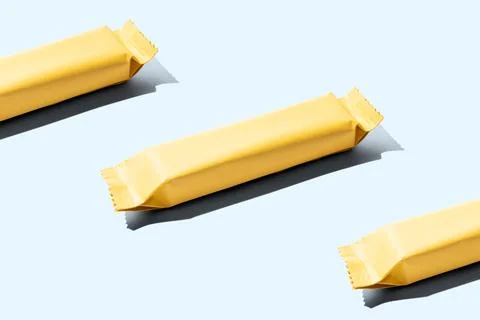 Yellow snack bar pattern mockup isolated on cyan background cutout Stock Photos
