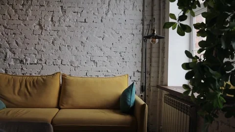 Yellow sofa with blue pillows in a modern interior Stock Footage 313656535