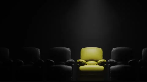 Yellow sofa Seat in front of black wall with spotlight Stock Footage 271193121