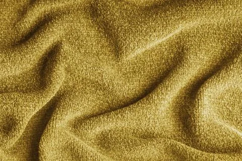 Yellow soft microfiber fabric texture background with folds and drapery. Ba.. Stock Photos
