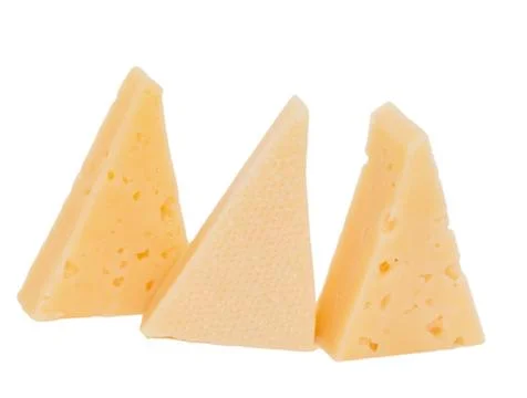 Yellow solid cheese pieces on the white background Stock Photos