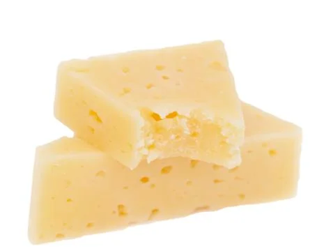 Yellow solid cheese pieces on the white background Stock Photos