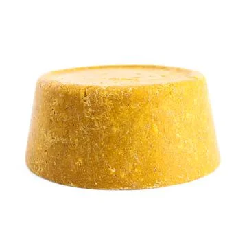 Yellow solid shampoo isolated on white. Hair care Stock Photos