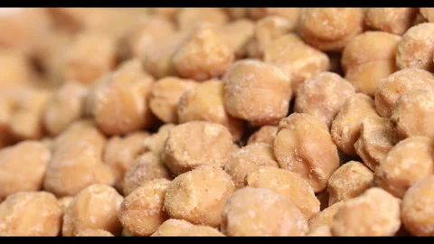 Yellow split chickpea peas boot chana dal lentil pulse bean on white background  Stock Footage 133557152