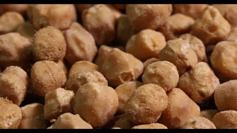 Yellow split chickpea peas boot chana dal lentil pulse bean on white background  Stock Footage 133557553