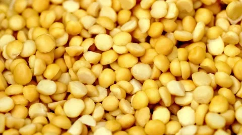 Yellow split peas in pot as water pours down covering the lentils with liquid Stock Footage 62851716