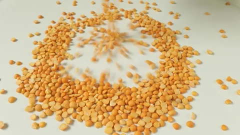 Yellow split peas pouring into a pile on white background Video stock 336038421