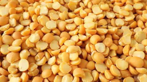 Yellow split peas rotating slowly Stock-Footage 334864032