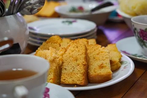 Yellow Sponge Cake Served With Tea Setting Stock Photos