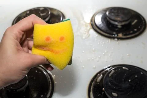Yellow sponge in hand Foto stock