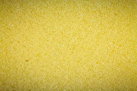 Yellow sponge made of microfiber material. Texture, background. In Increase 写真素材