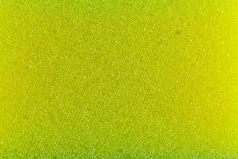 Yellow sponge made of microfiber material. Texture, background. In Increase Stock Photos