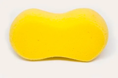 Yellow Sponge over white background Stock Photos