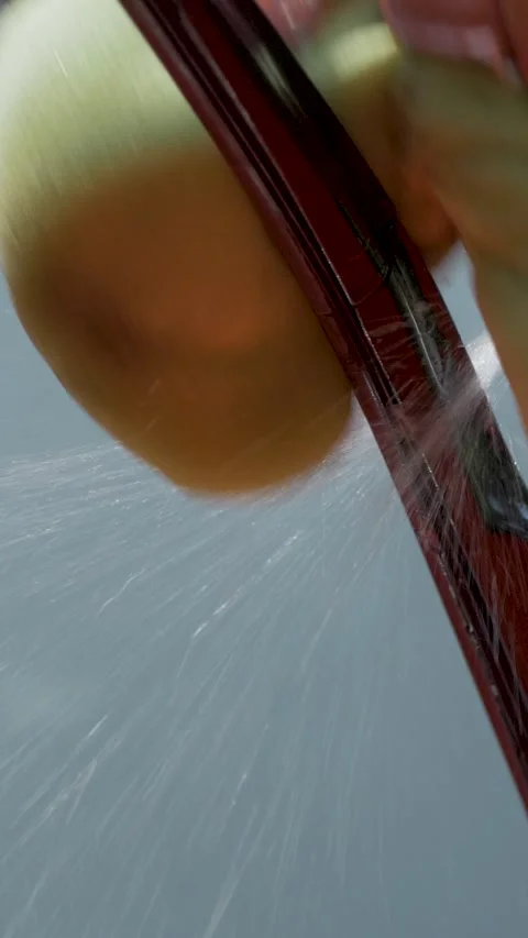 Yellow sponge used to clean windshield wipers on red car Stock Footage 323260144
