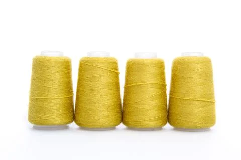 Yellow spool of thread isolated on white background. Skein of woolen threads Stock Photos
