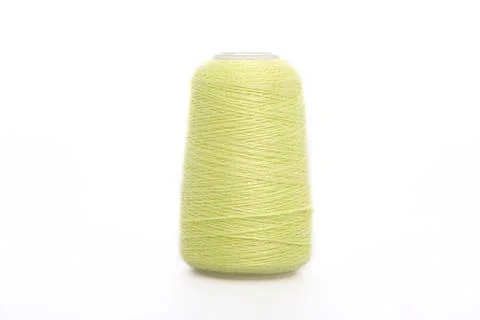 Yellow spool of thread isolated on white background. Skein of woolen threads Stock Photos
