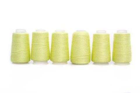 Yellow spool of thread isolated on white background. Skein of woolen threads Stock Photos