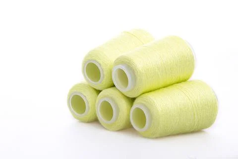 Yellow spool of thread isolated on white background. Skein of woolen threads Stock Photos