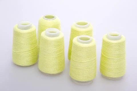 Yellow spool of thread isolated on white background. Skein of woolen threads Stock Photos