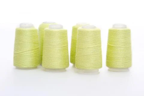 Yellow spool of thread isolated on white background. Skein of woolen threads Stock Photos