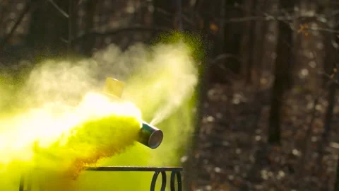 Yellow spray paint can being shot in slow motion by which it explodes and 스톡 동영상 284437815
