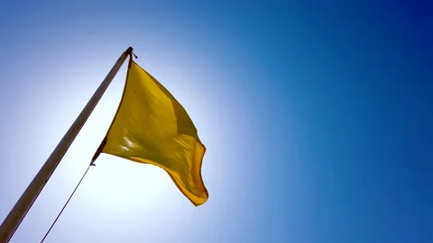 Yellow square flag in the wind Stock Footage 146076955