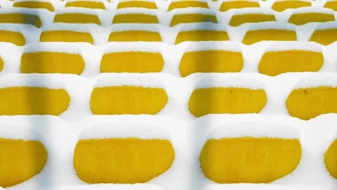 Yellow Stadium Chairs Covered With Fresh Snow Vídeo Stock 340483465