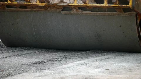 Yellow steamroller on road, Using roller compactor for road construction Stock Footage 276521620
