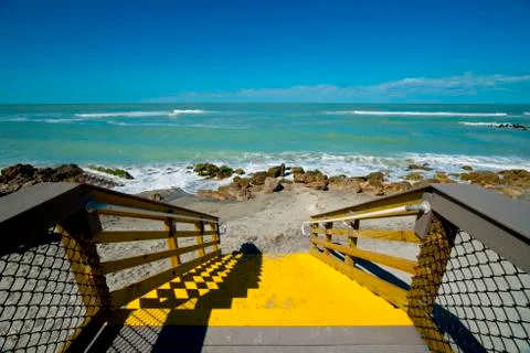 Yellow steps to beach Stock Photos