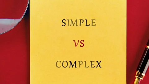 A yellow sticky note displays simple versus complex words, highlighted by a pen Stock Footage 333231087