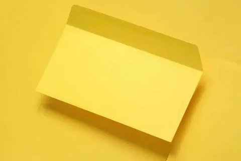 Yellow sticky note pad on yellow background Stock Photos