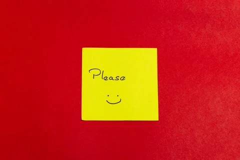 A yellow sticky note with a smiley face on it Stock Photos