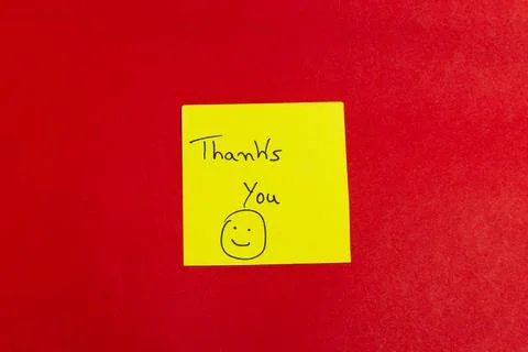 A yellow sticky note with a smiley face on it says "Thank you you" Stock Photos