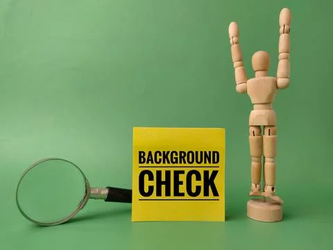 Yellow sticky note with the text BACKGROUND CHECK on a green background Stock Photos