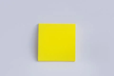 Yellow sticky note on white background. Color paper note. Back to school minimal Stock Photos