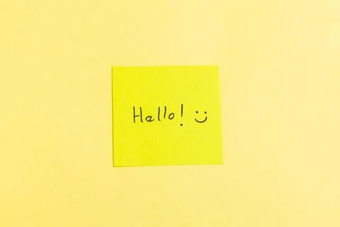 A yellow sticky note with the word "hello" written on it Stock Photos