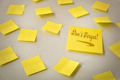 Yellow Sticky Notes with Don't Forget Message Stock Photos