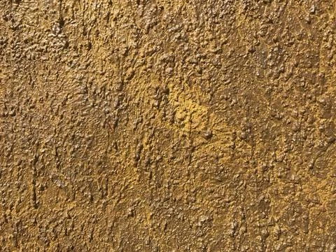 Yellow stone wall texture Stock Photos