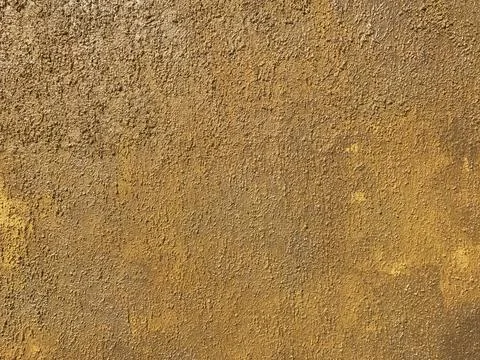Yellow stone wall texture Stock Photos