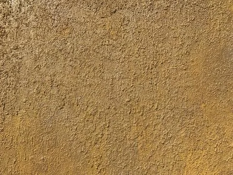 Yellow stone wall texture Stock Photos