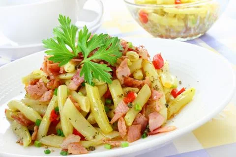 Yellow string beans with ham and paprika Stock Photos