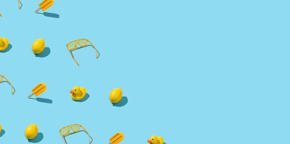 Yellow summer objects border frame on abstract blue background Stock Photos